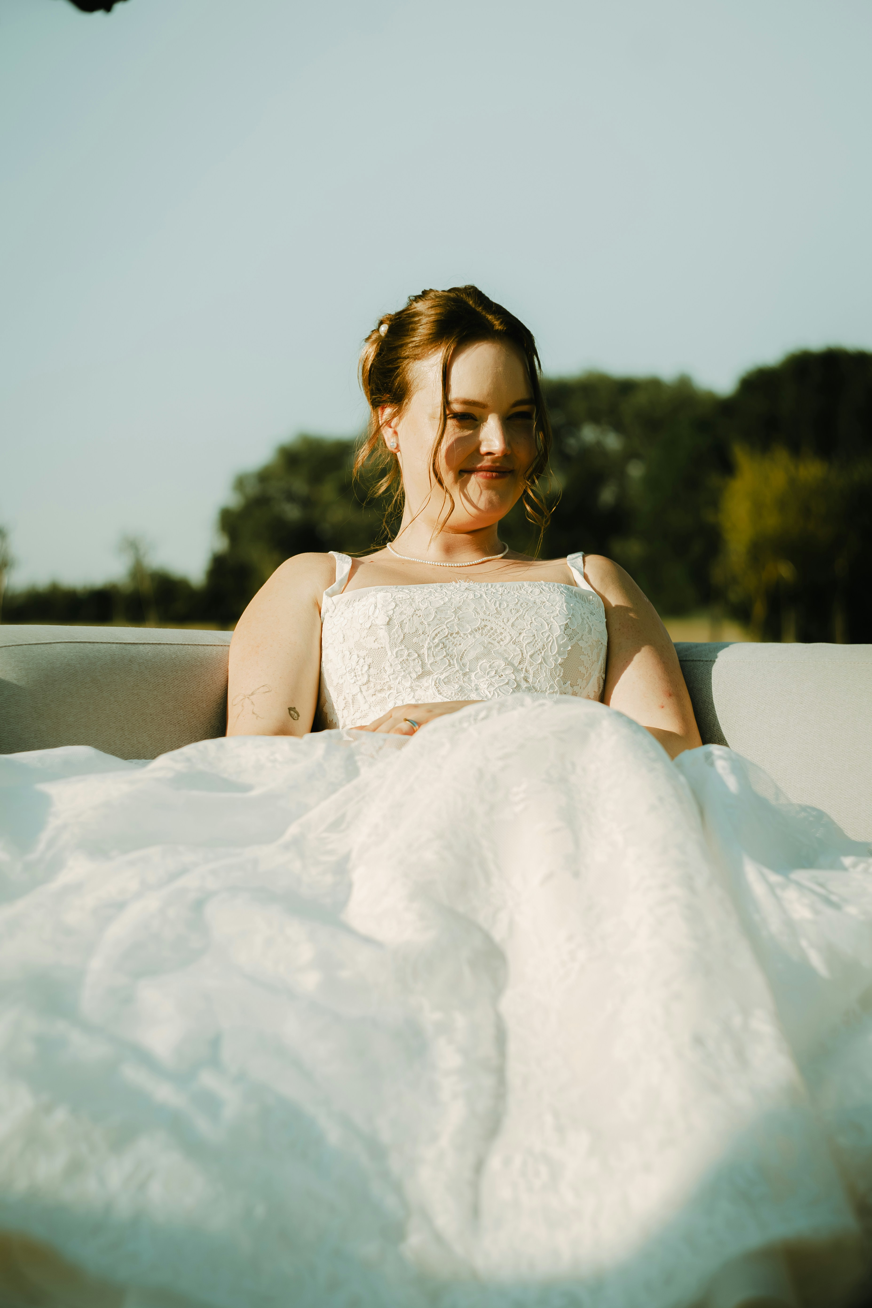 A Woman In A White Lace Dress Outdoors In Golden Hour Light HD mobile wallpaper