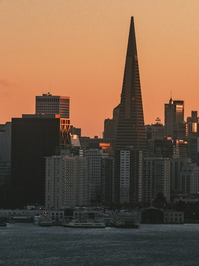 The Transamerica Pyramid And San Francisco Skyline At Golden Hour Above The Bay wallpaper preview