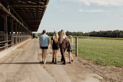 Group Walking Beside A Dairy Barn. Maryland, USA. wallpaper preview