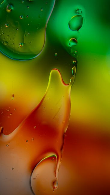 Vibrant Abstract Liquid Art With Bright Green, Red, And Yellow Colors Creating Dynamic Patterns. wallpaper preview