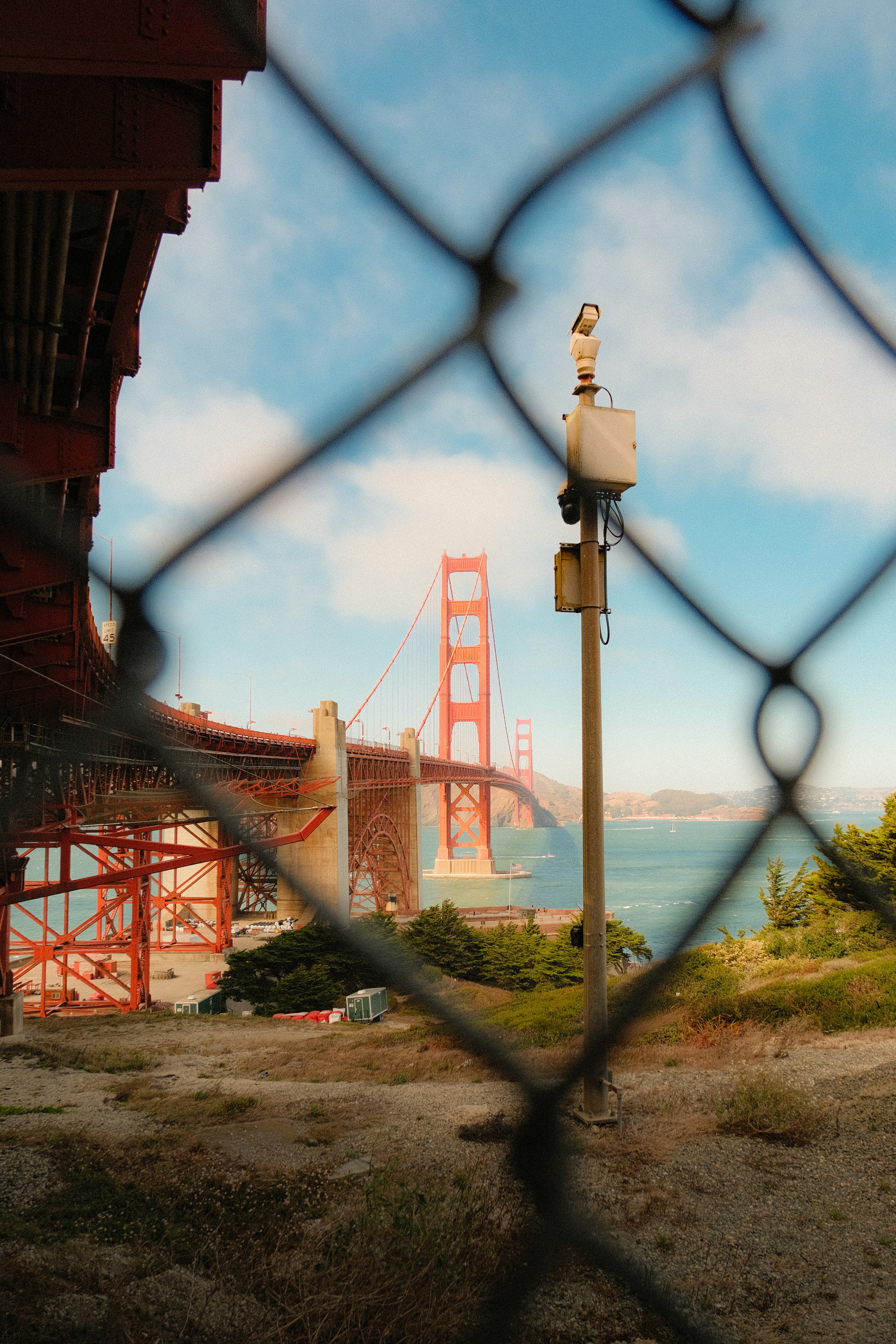 The Golden Gate Bridge In San Francisco Viewed Through A Chain Link Fence HD mobile wallpaper