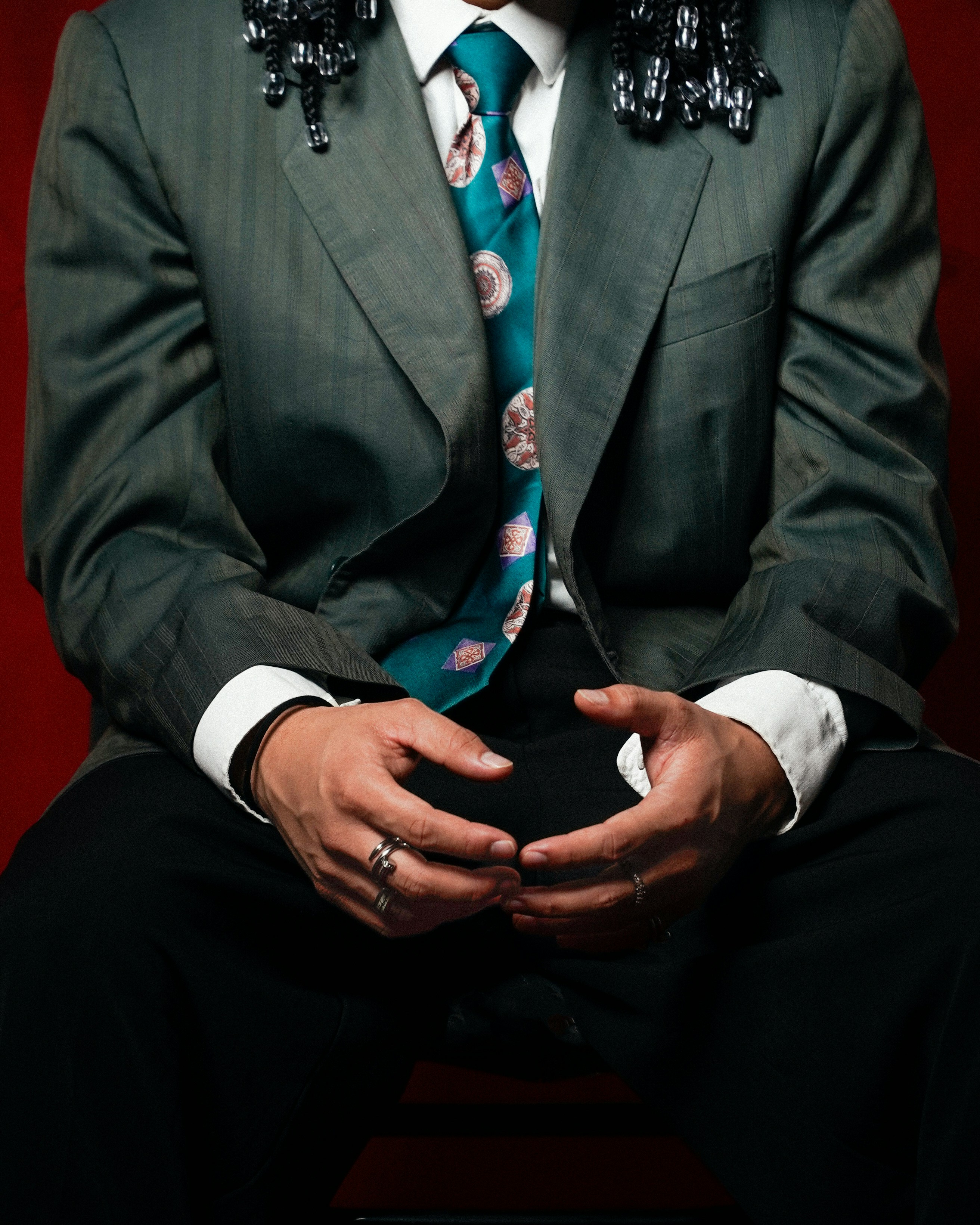 Man In Suit With Patterned Tie And Rings HD mobile wallpaper