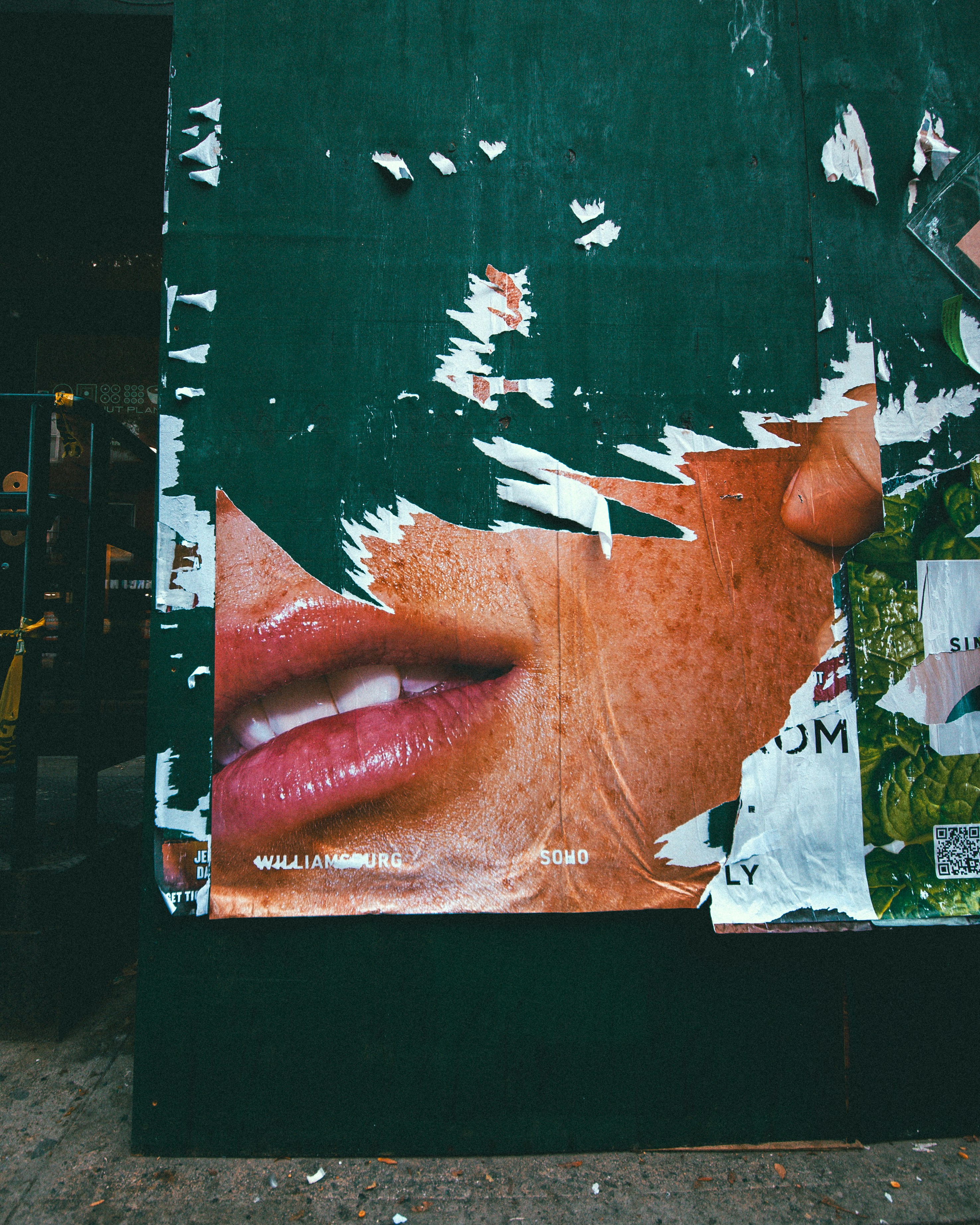Torn Advertising Posters On A Dark Green Wall In New York City HD mobile wallpaper