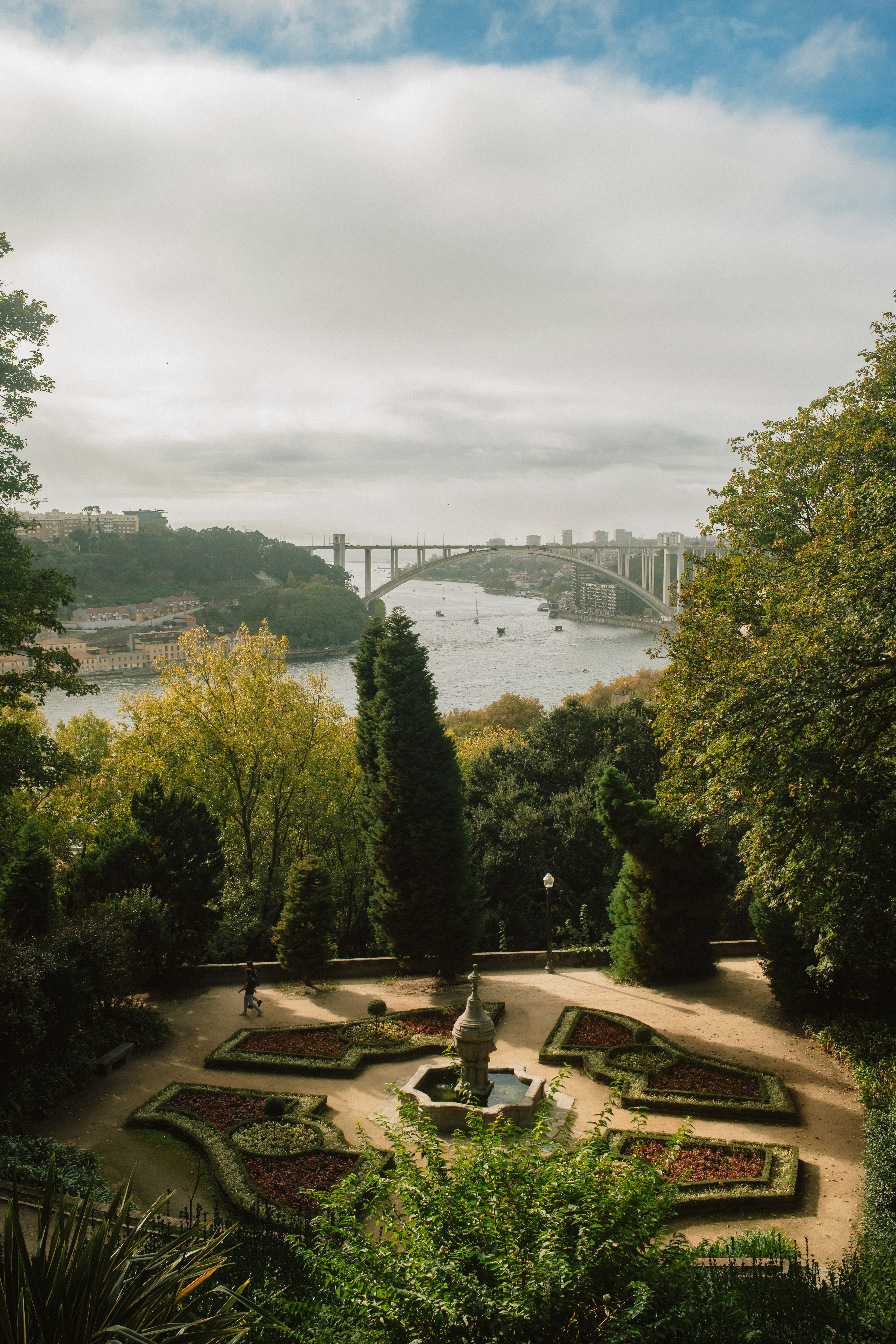 A Formal Garden With A Stone Fountain Overlooking The Douro River And Arrábida Bridge In Porto HD mobile wallpaper