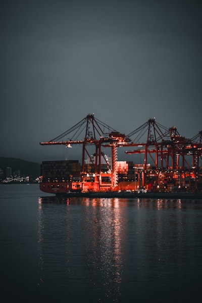 A Large Container Ship In The Water At Night wallpaper preview