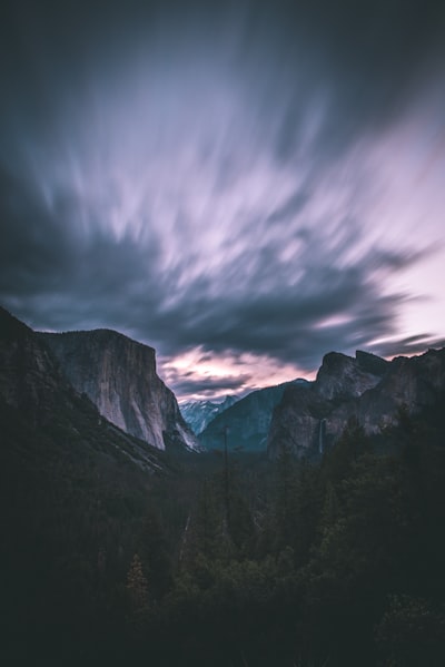 Landscape Photo Of Mountains Under Cloudy Sky wallpaper preview