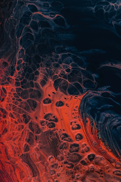 A Close Up Of A Red And Black Substance wallpaper preview