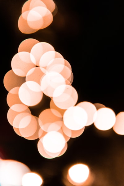 A Blurry Photo Of A Street Light At Night wallpaper preview