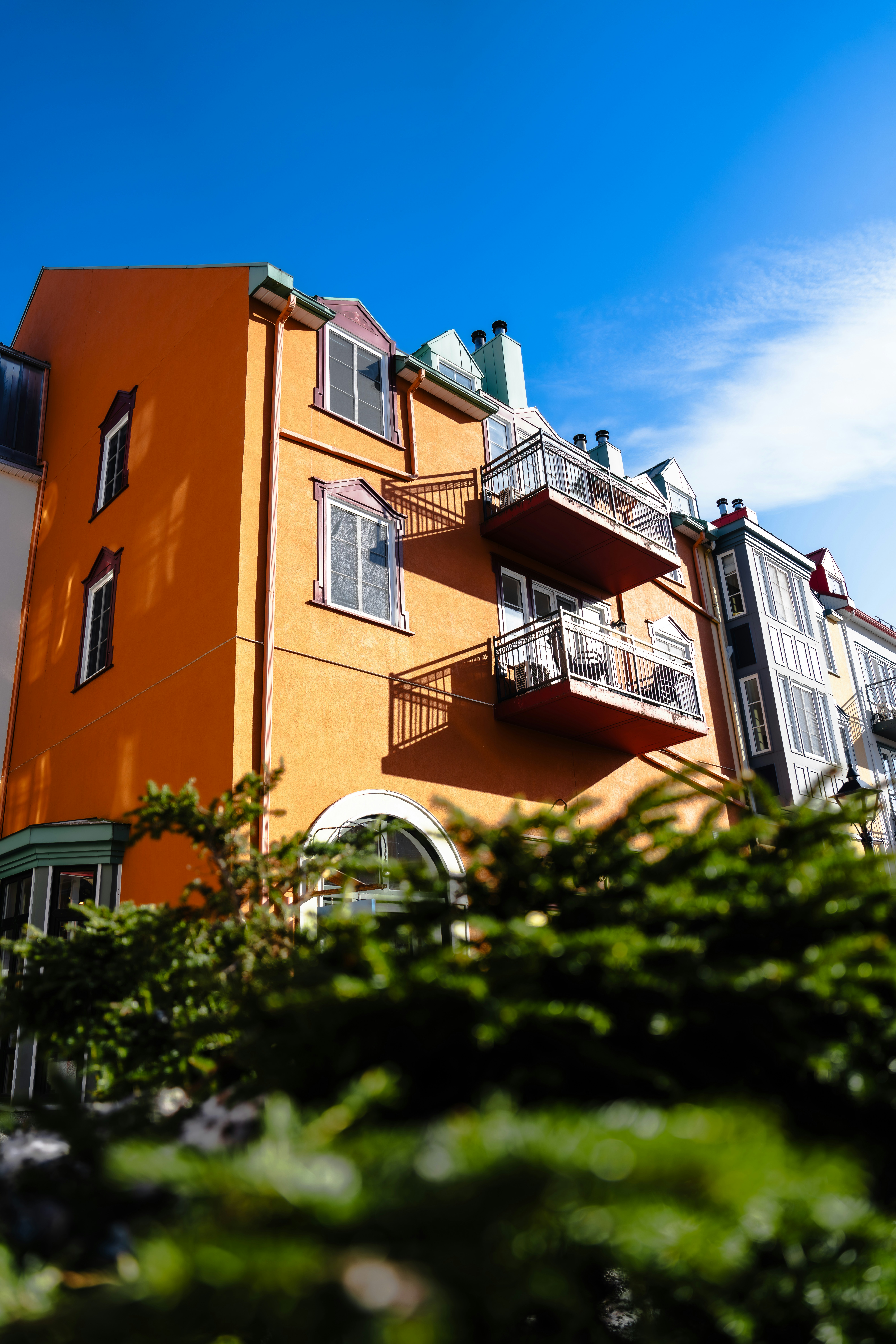 An Orange Building With Balconies And Balconies On The Balconies HD mobile wallpaper